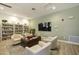 Comfortable library area with plush chairs, a large TV, and extensive bookshelves at 19475 N Grayhawk Dr # 2132, Scottsdale, AZ 85255