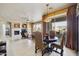 Open living room area featuring a fireplace, dining area, and access to the balcony at 19475 N Grayhawk Dr # 2132, Scottsdale, AZ 85255