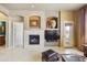 Inviting living room with cozy fireplace and built-in display niches, perfect for relaxing and entertaining at 19475 N Grayhawk Dr # 2132, Scottsdale, AZ 85255