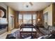 Cozy living room features bright windows with scenic views and comfortable seating arrangement at 19475 N Grayhawk Dr # 2132, Scottsdale, AZ 85255