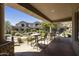 Inviting covered patio with seating and views of the meticulously landscaped grounds at 19475 N Grayhawk Dr # 2132, Scottsdale, AZ 85255