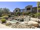Scenic pond with cascading waterfall, enhancing the community's tranquil ambiance at 19475 N Grayhawk Dr # 2132, Scottsdale, AZ 85255