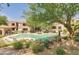 Refreshing community pool area with lounge chairs, lush greenery, and well-maintained grounds at 19475 N Grayhawk Dr # 2132, Scottsdale, AZ 85255