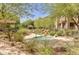 Inviting community spa with stone accents and lush landscaping, perfect for relaxation at 19475 N Grayhawk Dr # 2132, Scottsdale, AZ 85255