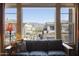 Scenic view from a bright living room window, showcasing desert landscape and neighborhood at 19475 N Grayhawk Dr # 2132, Scottsdale, AZ 85255