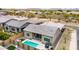 Aerial view showcasing the backyard oasis, pool and patio, with mountain views at 23434 N 76Th Way, Scottsdale, AZ 85255
