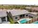Aerial view of backyard featuring sparkling pool, cozy patio, and lush landscaping at 23434 N 76Th Way, Scottsdale, AZ 85255