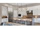 Modern kitchen features custom cabinetry, stainless steel appliances, and a large central island at 23434 N 76Th Way, Scottsdale, AZ 85255