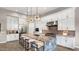 Gourmet kitchen with stainless steel appliances, custom cabinetry, and stylish pendant lighting at 23434 N 76Th Way, Scottsdale, AZ 85255