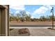 Pleasant landscaping and desert vegetation viewed from the paved driveway at 23434 N 76Th Way, Scottsdale, AZ 85255