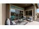 Inviting covered patio features comfortable seating and a view of the sparkling pool at 23434 N 76Th Way, Scottsdale, AZ 85255