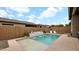 Beautiful pool and patio with water feature, lounge chairs, and desert landscaping at 23434 N 76Th Way, Scottsdale, AZ 85255