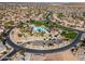 Aerial image showcasing a Primary-planned community with a pool, park, and neatly arranged homes at 235 S San Gregorio Ln, Casa Grande, AZ 85194