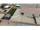 An aerial shot features a backyard oasis with artificial turf, spa and covered patio at 235 S San Gregorio Ln, Casa Grande, AZ 85194