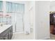 Bright bathroom features a glass enclosed shower, double sink vanity, and walk-in closet at 235 S San Gregorio Ln, Casa Grande, AZ 85194
