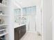 Bright bathroom features a glass enclosed shower, double sink vanity, and ample storage at 235 S San Gregorio Ln, Casa Grande, AZ 85194