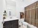 Bathroom features a shower with a curtain, a toilet, and a vanity sink at 235 S San Gregorio Ln, Casa Grande, AZ 85194