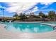 A community pool and slide features crystal clear blue water and a slide at 235 S San Gregorio Ln, Casa Grande, AZ 85194
