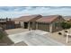 Attractive single-story house boasting a well-kept front yard and a spacious driveway at 235 S San Gregorio Ln, Casa Grande, AZ 85194