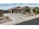 Charming single-story home featuring a well-maintained yard and attached two-car garage at 235 S San Gregorio Ln, Casa Grande, AZ 85194