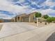 Charming single story home boasts a desert landscape, neutral paint, and an attached two car garage at 235 S San Gregorio Ln, Casa Grande, AZ 85194