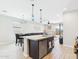 Open concept kitchen with pendant lights, stainless steel appliances, and granite countertop island at 235 S San Gregorio Ln, Casa Grande, AZ 85194