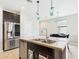 Kitchen island with stainless steel appliances and sink provides lots of countertop and cabinet space at 235 S San Gregorio Ln, Casa Grande, AZ 85194