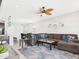 Open living room with fan flows into the kitchen and breakfast nook, creating a great gathering space at 235 S San Gregorio Ln, Casa Grande, AZ 85194