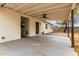 Spacious covered patio area extending to a low maintenance backyard and perimeter block fence at 2408 W Flower St, Phoenix, AZ 85015