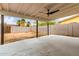 Covered patio leads to a large fenced backyard with a concrete slab and dirt at 2408 W Flower St, Phoenix, AZ 85015