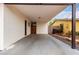 Covered carport featuring direct access to the home and view of adjacent building at 2408 W Flower St, Phoenix, AZ 85015