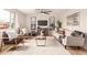 Inviting living room with stylish furnishings, neutral decor, and large windows providing ample natural light at 2408 W Flower St, Phoenix, AZ 85015