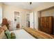 Cozy bedroom with an en-suite bathroom and walk-in closet, offering ample storage at 27280 N Makena Pl, Peoria, AZ 85383