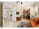 Inviting living room showcases tiled floors, open spaces, and a dedicated office nook at 27280 N Makena Pl, Peoria, AZ 85383