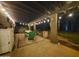 A quaint porch with outdoor dining, complimented by string lights at 2833 E Emile Zola Ave, Phoenix, AZ 85032