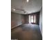 Bright bedroom with neutral walls, a ceiling fan, and sliding glass doors to the backyard at 2833 E Emile Zola Ave, Phoenix, AZ 85032