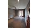 Bedroom with gray walls, sliding glass doors, and plush carpet flooring at 2833 E Emile Zola Ave, Phoenix, AZ 85032