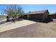 This house has a wide driveway and desert-style landscaping at 2833 E Emile Zola Ave, Phoenix, AZ 85032