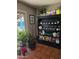 Eclectic interior with shelving displaying plants and books by the back door, showcasing personality at 2833 E Emile Zola Ave, Phoenix, AZ 85032