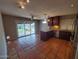 Eat-in kitchen with terracotta tile flooring, stainless steel appliances, updated cabinets, and access to the backyard at 2833 E Emile Zola Ave, Phoenix, AZ 85032