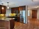 Modern kitchen with stainless steel appliances, granite countertops, and stylish pendant lighting at 2833 E Emile Zola Ave, Phoenix, AZ 85032