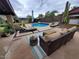 Outdoor pool area featuring comfortable seating, a pristine pool, and a charming poolside bar for entertaining at 2833 E Emile Zola Ave, Phoenix, AZ 85032