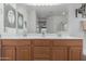Bright bathroom featuring a double sink vanity with a large mirror and white countertop at 3023 E Silversmith Trl, San Tan Valley, AZ 85143