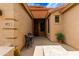 Inviting entryway showcasing a cozy seating area, house numbers, and a clear view into the home at 3023 E Silversmith Trl, San Tan Valley, AZ 85143