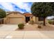 Charming single-story home featuring a well-manicured yard, neutral stucco, and an attached two-car garage at 3023 E Silversmith Trl, San Tan Valley, AZ 85143