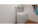 Clean laundry room featuring a modern washer and dryer with shelving at 3023 E Silversmith Trl, San Tan Valley, AZ 85143