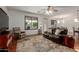 Comfortable living area featuring cozy seating, a patterned rug, and ample natural light at 3023 E Silversmith Trl, San Tan Valley, AZ 85143