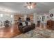 Open-concept living room featuring tile floors, large windows, and seamless flow to the kitchen at 3023 E Silversmith Trl, San Tan Valley, AZ 85143