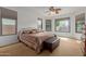 Bright and airy main bedroom with natural light and bay windows overlooking the yard at 3023 E Silversmith Trl, San Tan Valley, AZ 85143