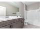 Bright bathroom with a double sink vanity and a shower-tub combo at 30323 W Sheila Ln, Buckeye, AZ 85396